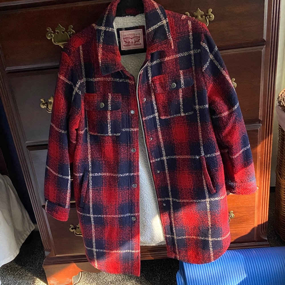 A 3/4 Barn Jacket with faux Sherpa inner lining.